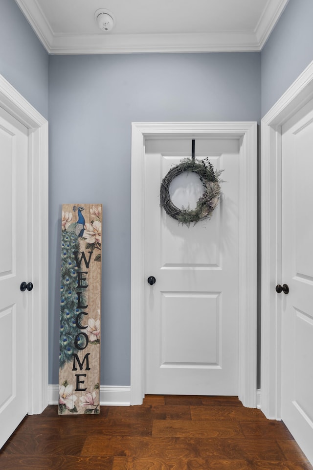 entryway featuring dark hardwood / wood-style floors and ornamental molding