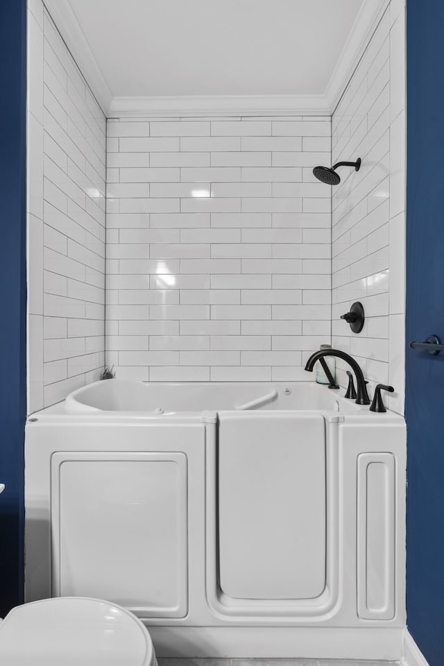 bathroom featuring  shower combination, toilet, and ornamental molding