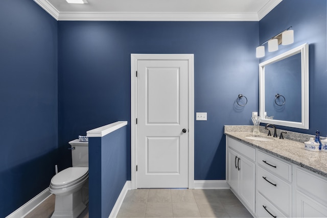 bathroom with tile patterned floors, crown molding, vanity, and toilet