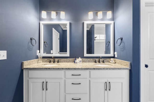 bathroom featuring vanity and ornamental molding