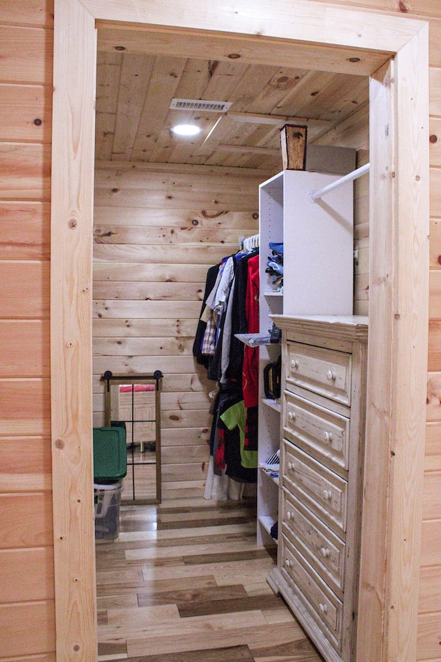 walk in closet featuring wood finished floors