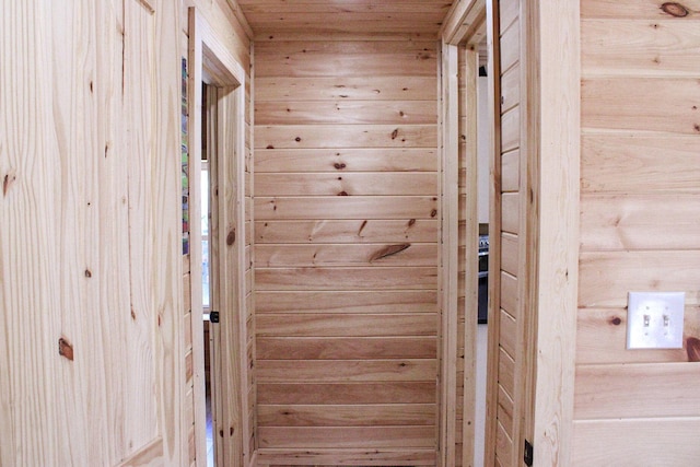 interior space with wooden walls and wood ceiling