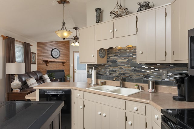 kitchen featuring open floor plan, black dishwasher, decorative backsplash, a fireplace, and a sink