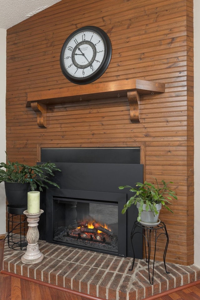 details with a glass covered fireplace