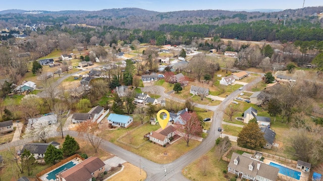 bird's eye view with a residential view and a wooded view