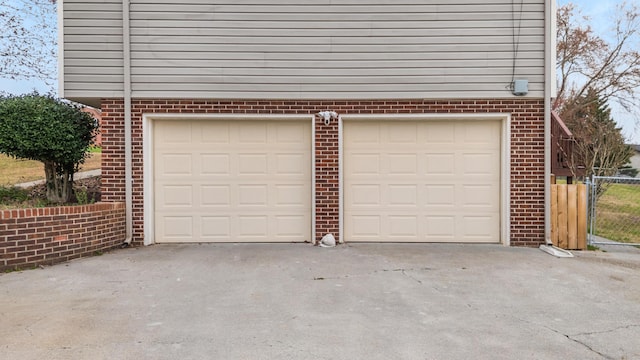 garage with concrete driveway