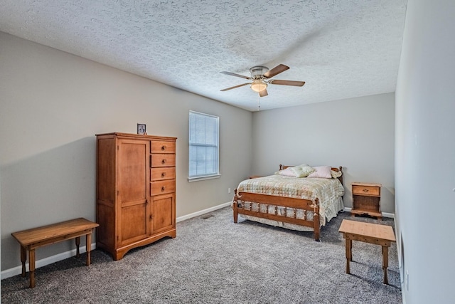 carpeted bedroom featuring a textured ceiling, ceiling fan, and baseboards