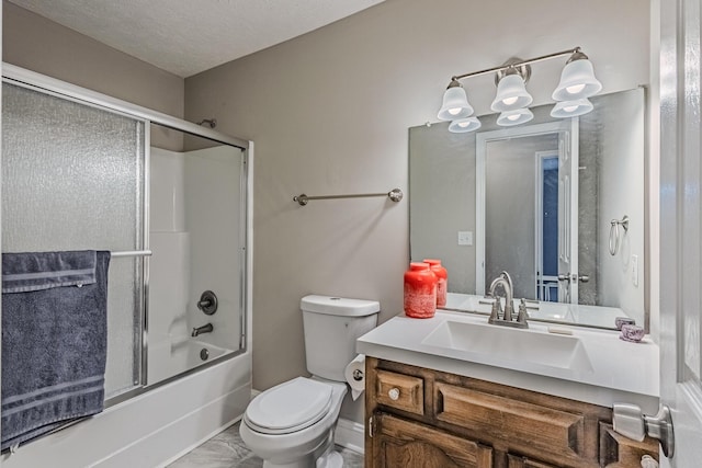 bathroom with toilet, shower / bath combination with glass door, and vanity