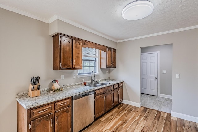 kitchen featuring a sink, baseboards, light wood-type flooring, dishwasher, and crown molding