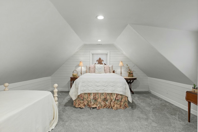 bedroom with lofted ceiling and carpet floors