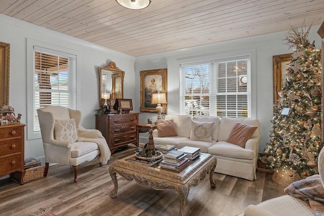 living area with hardwood / wood-style flooring, a healthy amount of sunlight, and wood ceiling