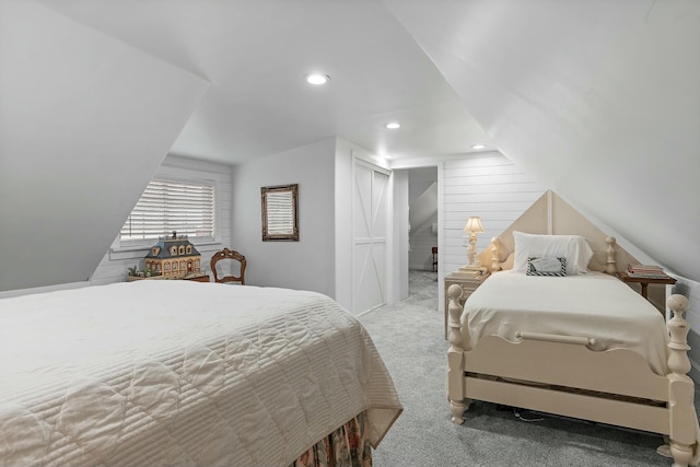 bedroom featuring carpet and vaulted ceiling