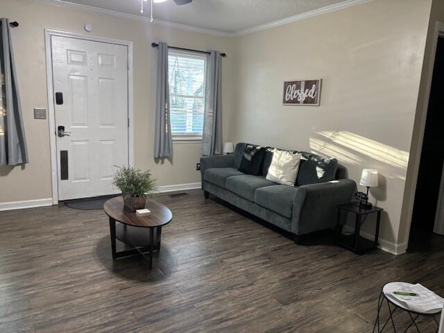 living room with ceiling fan, dark hardwood / wood-style flooring, and ornamental molding