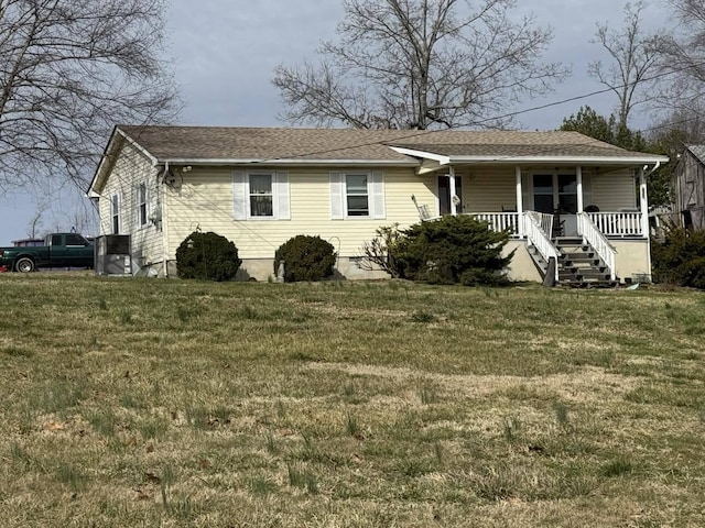 view of front of home with a front lawn and a porch