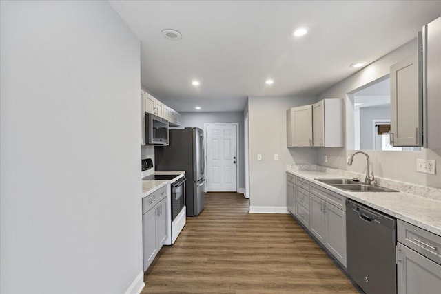 242 Mulberry Ln NE, Cleveland, TN 37312 - kitchen with stainless steel appliances, recessed lighting, light countertops, dark wood finished floors, and gray cabinetry