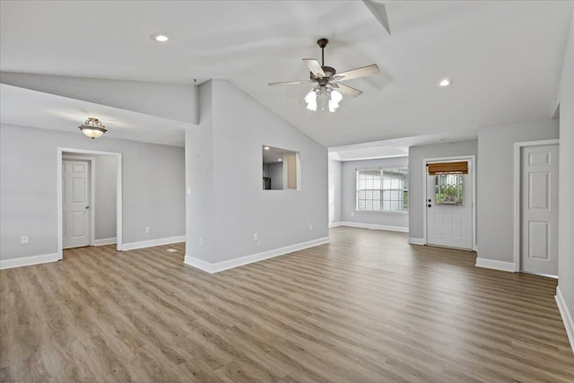 242 Mulberry Ln NE, Cleveland, TN 37312 - unfurnished living room featuring a ceiling fan, lofted ceiling, wood finished floors, and recessed lighting