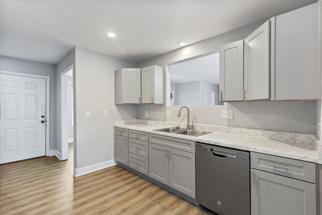 242 Mulberry Ln NE, Cleveland, TN 37312 - kitchen with stainless steel dishwasher, gray cabinets, light wood-type flooring, recessed lighting, and light stone countertops