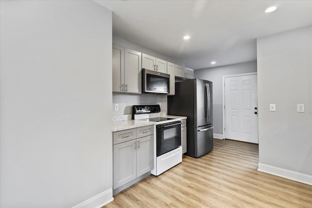 242 Mulberry Ln NE, Cleveland, TN 37312 - kitchen with appliances with stainless steel finishes, light wood-type flooring, recessed lighting, and gray cabinetry