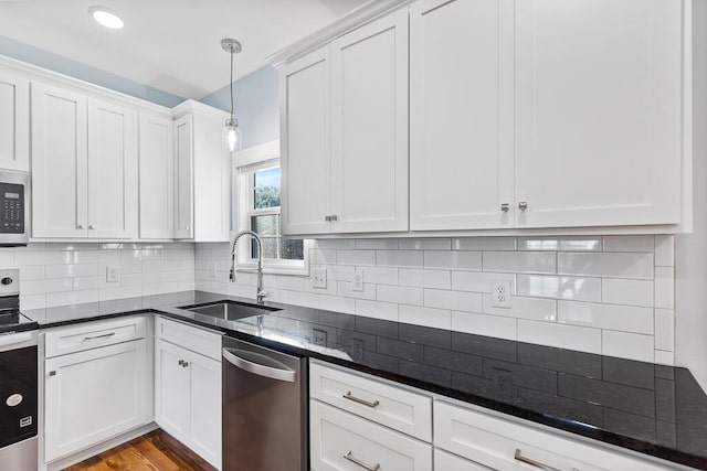 605 Westover Dr SW, Cleveland, TN 37311 - kitchen featuring stainless steel appliances, white cabinetry, dark stone countertops, decorative light fixtures, and tasteful backsplash