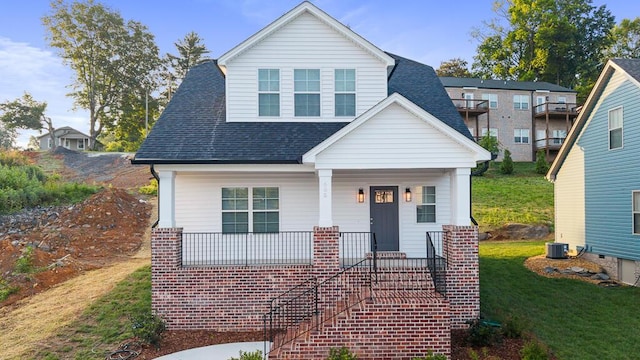 605 Westover Dr SW, Cleveland, TN 37311 - view of front of house with a shingled roof, a front lawn, and a porch