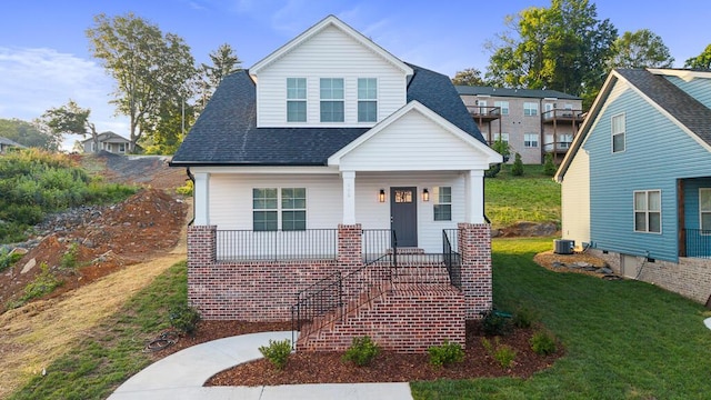 605 Westover Dr SW, Cleveland, TN 37311 - view of front of property featuring a shingled roof, covered porch, a front lawn, and stairway