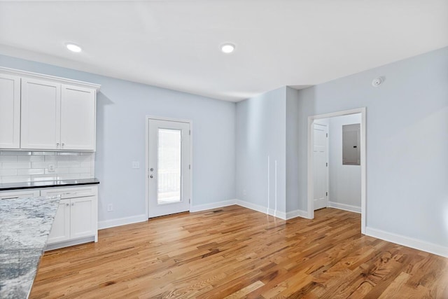 605 Westover Dr SW, Cleveland, TN 37311 - unfurnished living room with light wood-style floors, electric panel, and recessed lighting