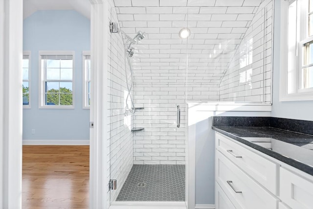 605 Westover Dr SW, Cleveland, TN 37311 - full bathroom with vaulted ceiling, a stall shower, vanity, and wood finished floors