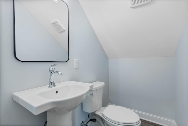 605 Westover Dr SW, Cleveland, TN 37311 - half bathroom featuring toilet and vaulted ceiling