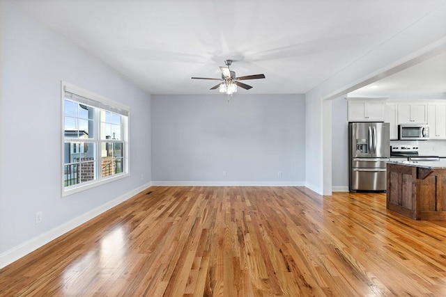 605 Westover Dr SW, Cleveland, TN 37311 - unfurnished living room with ceiling fan and light wood-style flooring