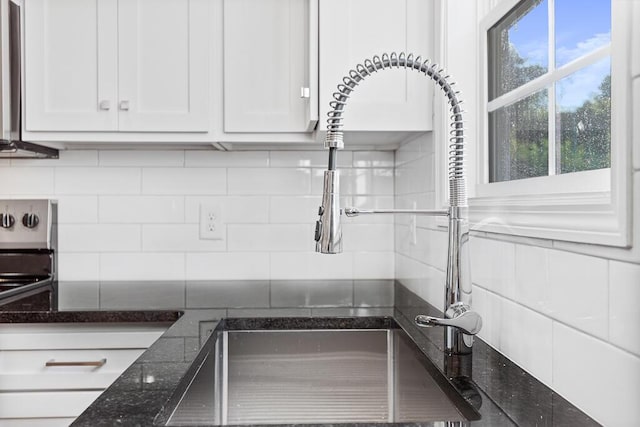 605 Westover Dr SW, Cleveland, TN 37311 - kitchen view of white cabinets, backsplash, and dark stone counters