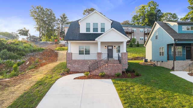 605 Westover Dr SW, Cleveland, TN 37311 - view of front facade with covered porch, stairs, a front yard, and a shingled roof