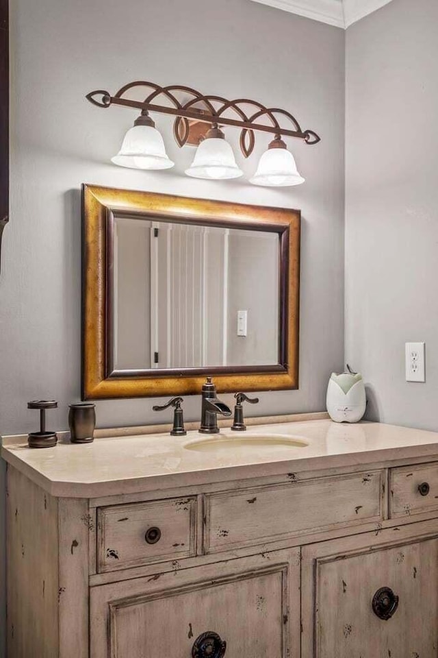 bathroom featuring vanity and ornamental molding