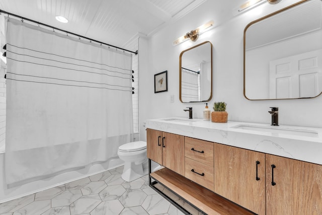 full bathroom featuring shower / bath combination with curtain, toilet, double vanity, and a sink