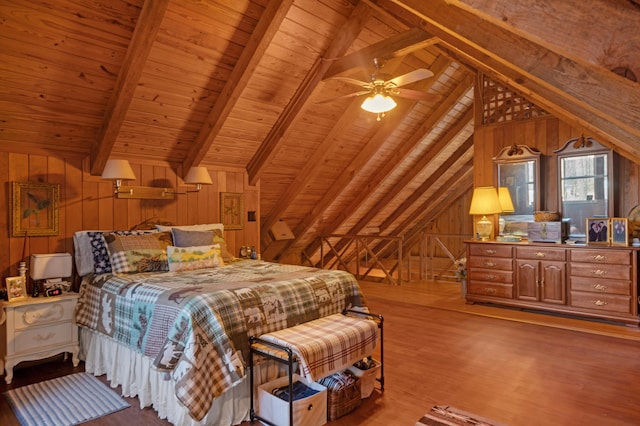 bedroom with hardwood / wood-style floors, vaulted ceiling with beams, wood walls, ceiling fan, and wooden ceiling