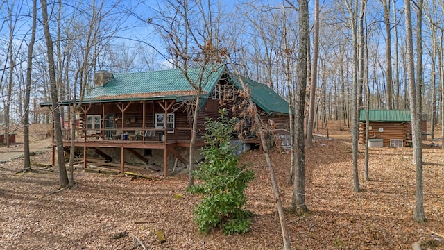 back of house featuring a deck