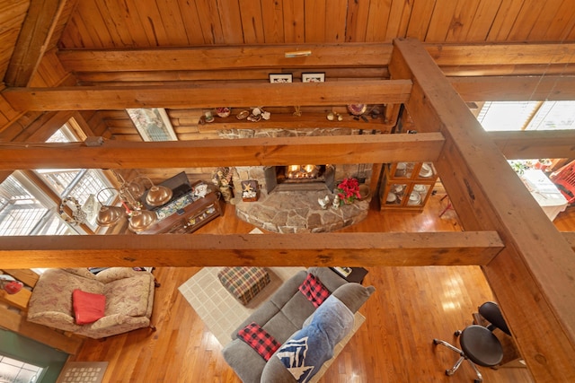 living room with wood ceiling and beamed ceiling