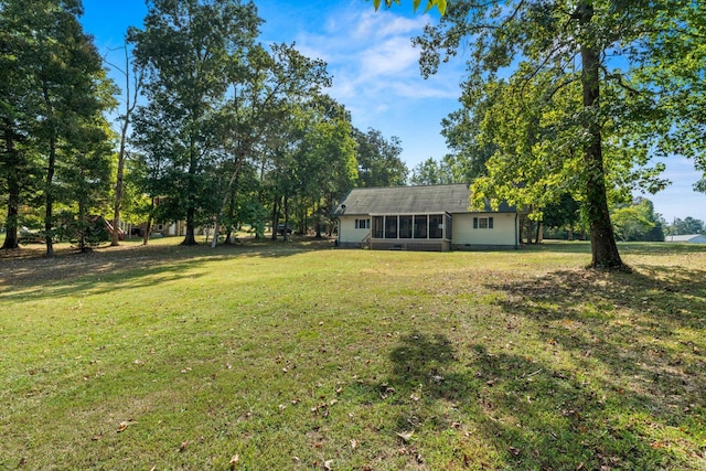 view of yard featuring a sunroom