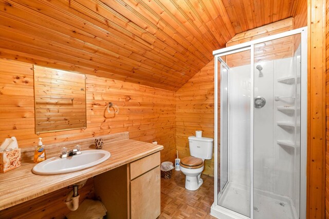 bathroom featuring an enclosed shower, wood ceiling, vaulted ceiling, sink, and toilet