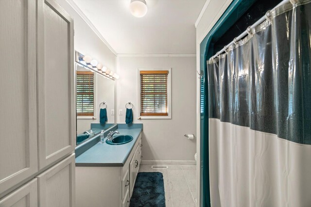 bathroom featuring vanity and ornamental molding