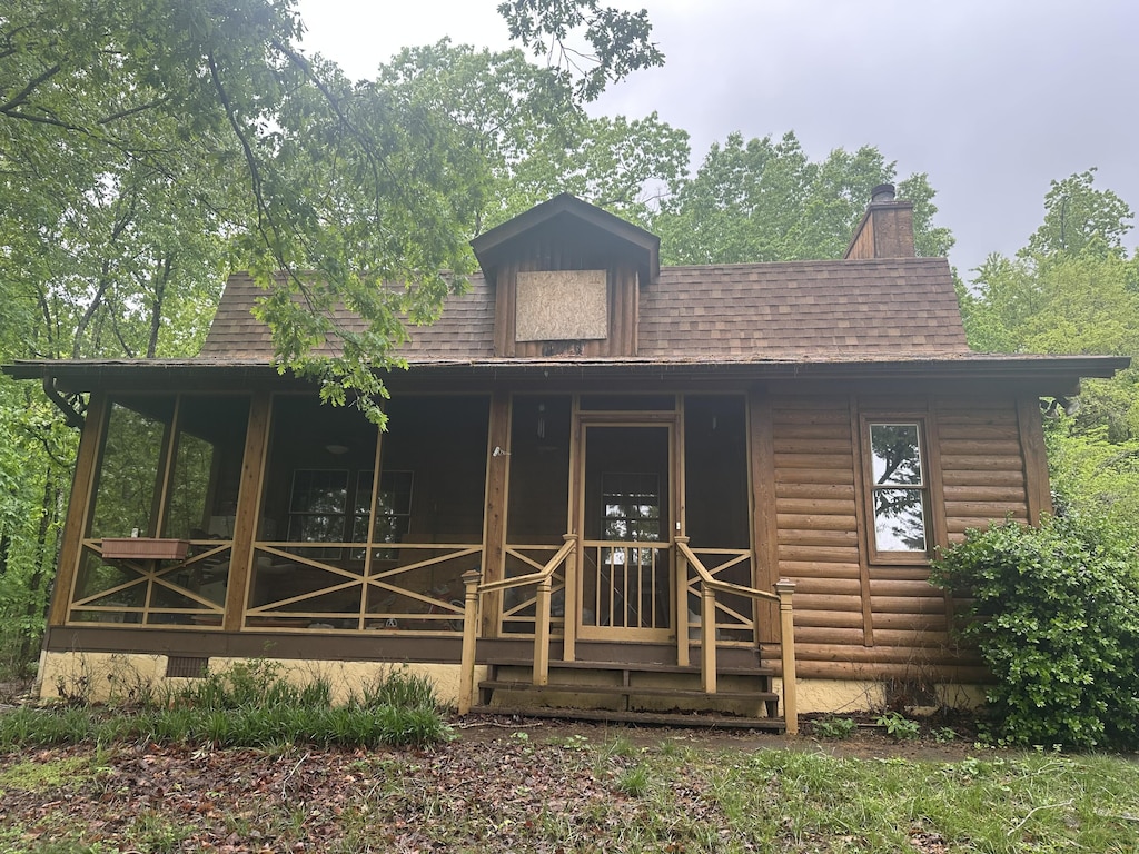 1250 Dellview Way SW, Cleveland, TN 37311 - view of front facade featuring a porch, a shingled roof, and a chimney