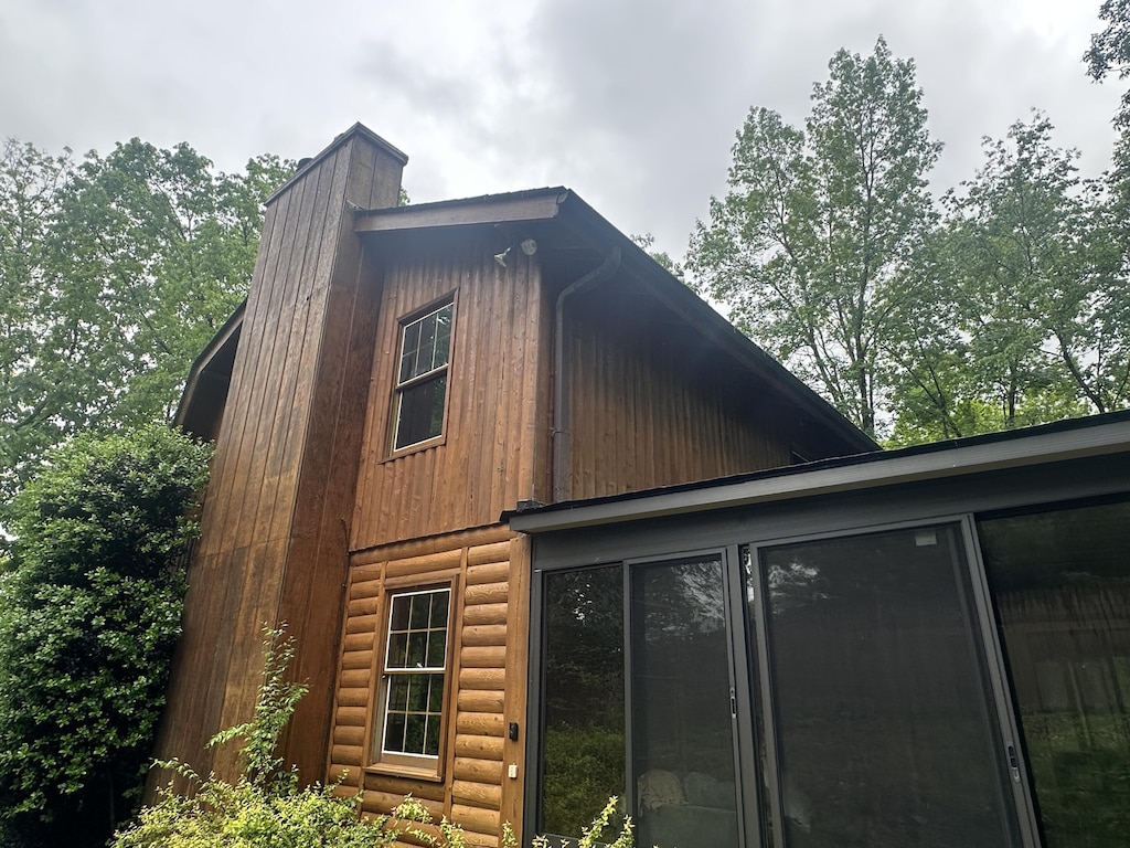 1250 Dellview Way SW, Cleveland, TN 37311 - view of property exterior with a gambrel roof, a chimney, and a sunroom