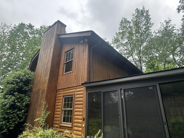 1250 Dellview Way SW, Cleveland, TN 37311 - view of property exterior with a gambrel roof, a chimney, and a sunroom