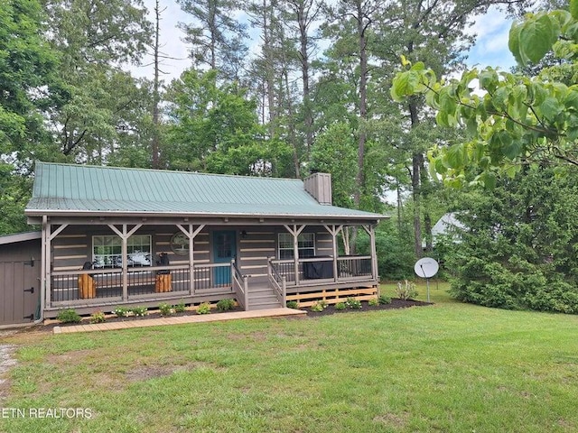 125 Hiwassee Cir, Reliance, TN 37369 - view of front facade with covered porch, a front yard, a chimney, and metal roof