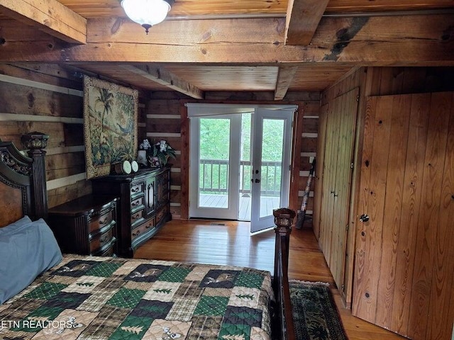 125 Hiwassee Cir, Reliance, TN 37369 - bedroom featuring wood walls, light wood-style floors, wooden ceiling with exposed beams, access to outside, and french doors