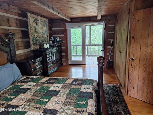 125 Hiwassee Cir, Reliance, TN 37369 - bedroom with wooden ceiling with exposed beams, wood walls, light wood finished floors, and access to exterior