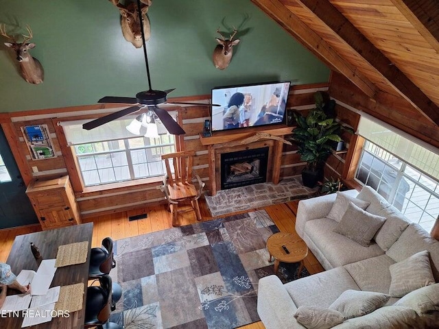 125 Hiwassee Cir, Reliance, TN 37369 - living area featuring ceiling fan, wood finished floors, and a fireplace with raised hearth