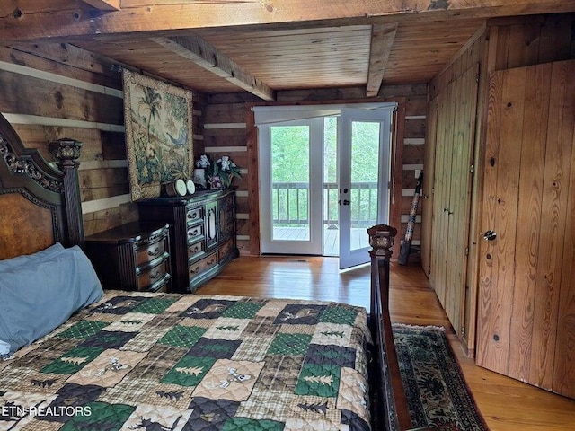 125 Hiwassee Cir, Reliance, TN 37369 - bedroom featuring wood ceiling with exposed beams, wooden walls, light wood finished floors, access to exterior, and french doors