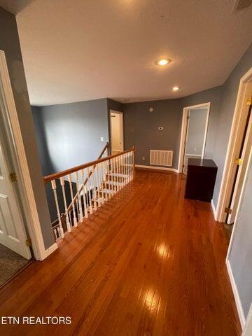 hallway featuring hardwood / wood-style flooring