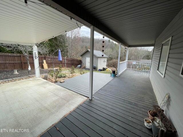 wooden deck with a storage unit