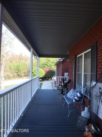 wooden terrace featuring a porch